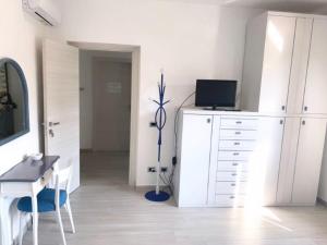 Televiisor ja/või meelelahutuskeskus majutusasutuses B&B La coccola
