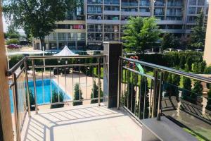 a balcony with a view of a pool and a building at VIP VISION - 214 entire flat 2 beds two baths in Sunny Beach