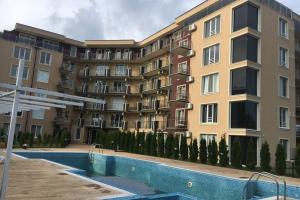 an apartment building with a pool in front of it at VIP VISION - 214 entire flat 2 beds two baths in Sunny Beach