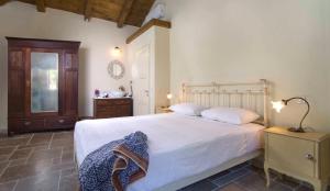 Ένα ή περισσότερα κρεβάτια σε δωμάτιο στο BellaZante Country Villas
