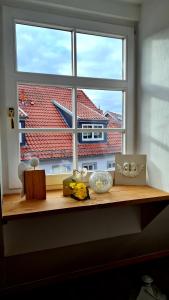 a window with a view of a building at Apartement *Harzblick* in Nordhausen