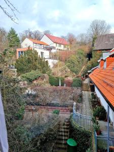 a view of a house with stairs and houses at Apartement *Harzblick* in Nordhausen