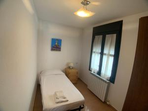 Postel nebo postele na pokoji v ubytování VUT SEGEDA Valle del Manubles