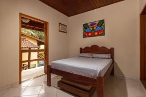 Cama ou camas em um quarto em Pousada Cabeça do Indio - Trindade