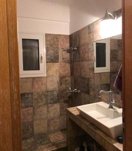 Een badkamer bij Sxinias Resort