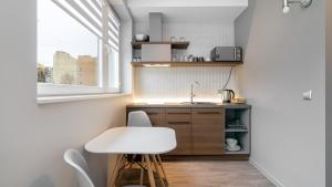 Kuchyňa alebo kuchynka v ubytovaní Comfy Apartments - Park Technologiczny