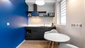 Kuchyňa alebo kuchynka v ubytovaní Comfy Apartments - Park Technologiczny
