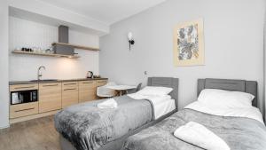 Posteľ alebo postele v izbe v ubytovaní Comfy Apartments - Park Technologiczny