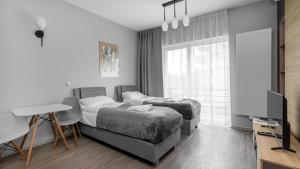 Posteľ alebo postele v izbe v ubytovaní Comfy Apartments - Park Technologiczny