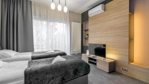 Posteľ alebo postele v izbe v ubytovaní Comfy Apartments - Park Technologiczny