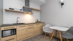 Kuchyňa alebo kuchynka v ubytovaní Comfy Apartments - Park Technologiczny