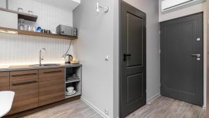 Kuchyňa alebo kuchynka v ubytovaní Comfy Apartments - Park Technologiczny + 20 fotografií