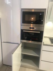 Kuchnia lub aneks kuchenny w obiekcie Apartamentos La Encarnación III