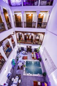 an overhead view of a swimming pool in a building at Riad Atlas Mejbar in Marrakech