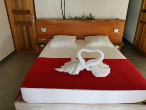 Tempat tidur dalam kamar di Villa Maria'Landa