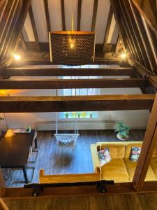 an attic view of a living room with stairs at Torenkamer Middelburgh in Middelburg