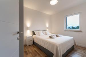 Postel nebo postele na pokoji v ubytování Villa Iva