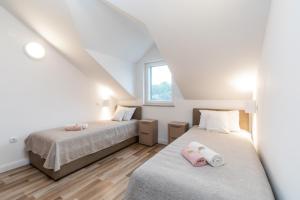 Postel nebo postele na pokoji v ubytování Villa Iva