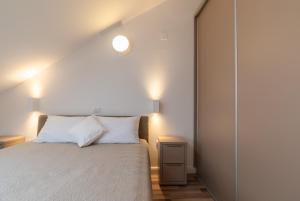 Postel nebo postele na pokoji v ubytování Villa Iva