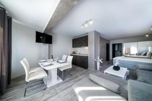 a living room with a couch and a table at Boutique Guest House"Ruvan" in Burgas