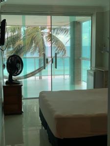 Výhled na bazén z ubytování Casa de Praia Pitimbu nebo okolí