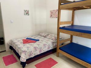 a bedroom with a bunk bed and a ladder at Guarajuba sitiofelizcidade in Guarajuba +45 photos