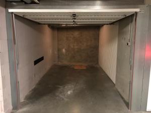 an empty room with a door in a garage at Duplex Blankenberge in Blankenberge
