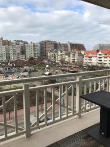 a view of a city from a balcony at Duplex Blankenberge in Blankenberge