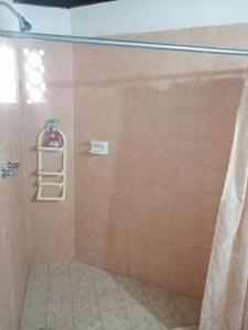 a bathroom with a shower with a shower curtain at Margaritas101 in Cancún