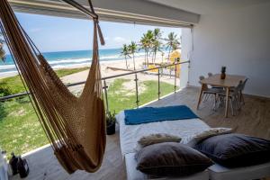 a hammock room with a view of the beach at Residencial Mañanero in Cabarete