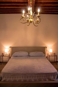 Postel nebo postele na pokoji v ubytování Fonte alle Ninfe B&B