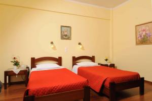 Postel nebo postele na pokoji v ubytování Sunset Hotel
