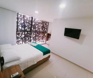 Posteľ alebo postele v izbe v ubytovaní Hotel Sie7e