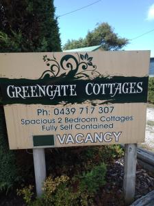 a sign for a green certificate certificatesemetery istg at GreenGate Cottages in Strahan