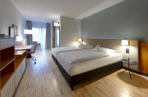 Säng eller sängar i ett rum på Hotel am Kloster