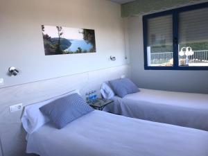Postel nebo postele na pokoji v ubytování Hotel Kanala