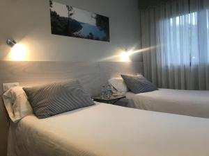 Postel nebo postele na pokoji v ubytování Hotel Kanala