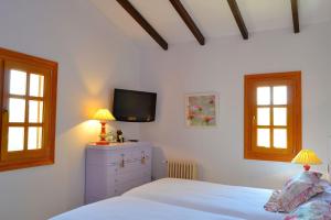 Postel nebo postele na pokoji v ubytování Villa Casa Binissagar II 106 by Mallorca Charme + 25 fotografií