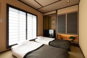 Llit o llits en una habitació de Shirakabanoyado - Seiran