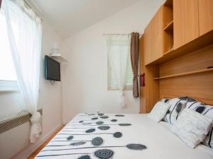 Кровать или кровати в номере Deluxe Apartment Toni