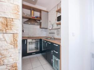 Кухня или мини-кухня в Deluxe Apartment Toni

