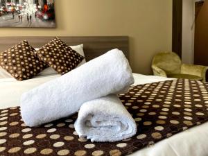 Postel nebo postele na pokoji v ubytování Best Western Plus Camperdown Suites