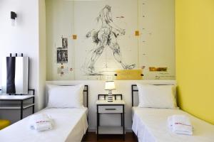 Postel nebo postele na pokoji v ubytování Osten Art Hotel