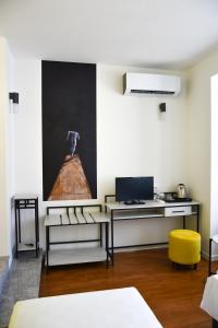 TV a/nebo společenská místnost v ubytování Osten Art Hotel
