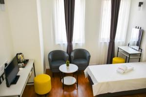 Postel nebo postele na pokoji v ubytování Osten Art Hotel