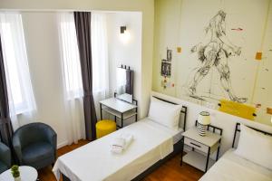 Postel nebo postele na pokoji v ubytování Osten Art Hotel
