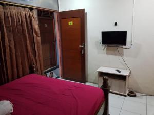 TV a/nebo společenská místnost v ubytování Hotel Alifah 1 Syariah