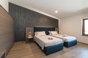 A bed or beds in a room at Hotel Da Si-Si