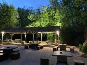 a pavilion with tables and benches in a park at The Deeping Stage in Market Deeping +16 photos