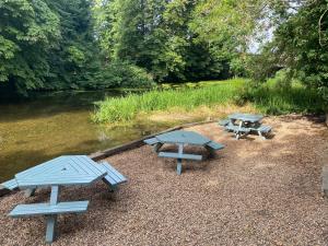 a group of picnic tables next to a river at Deeping Stage in Market Deeping +21 photos